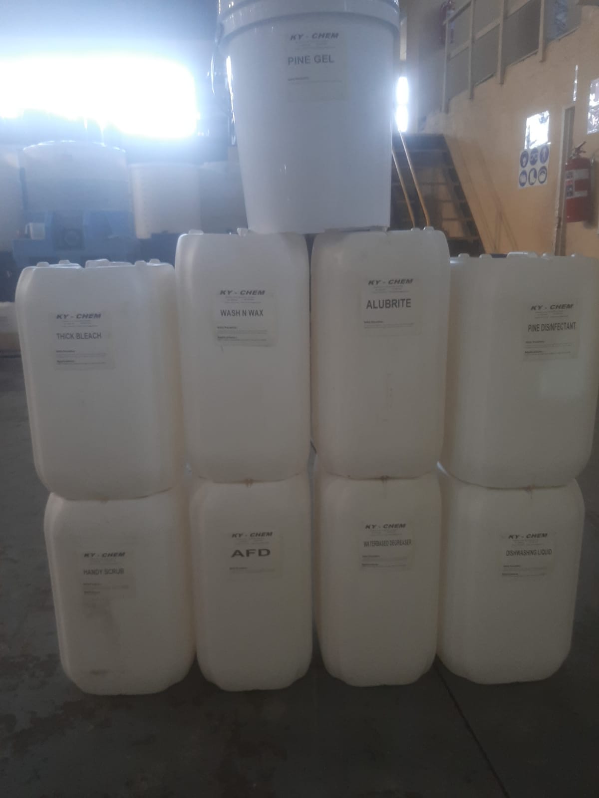 White buckets of chemicals produced by KY Chem based in Phoenix Industrial Park